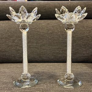 Pair of glass lotus votive candle holders.